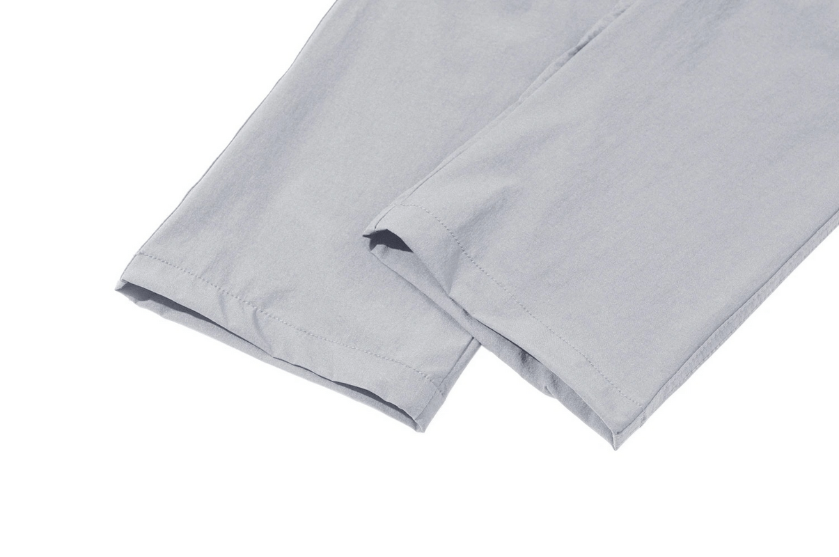 Close-up of gray waterproof hiking pants for men, straight legs